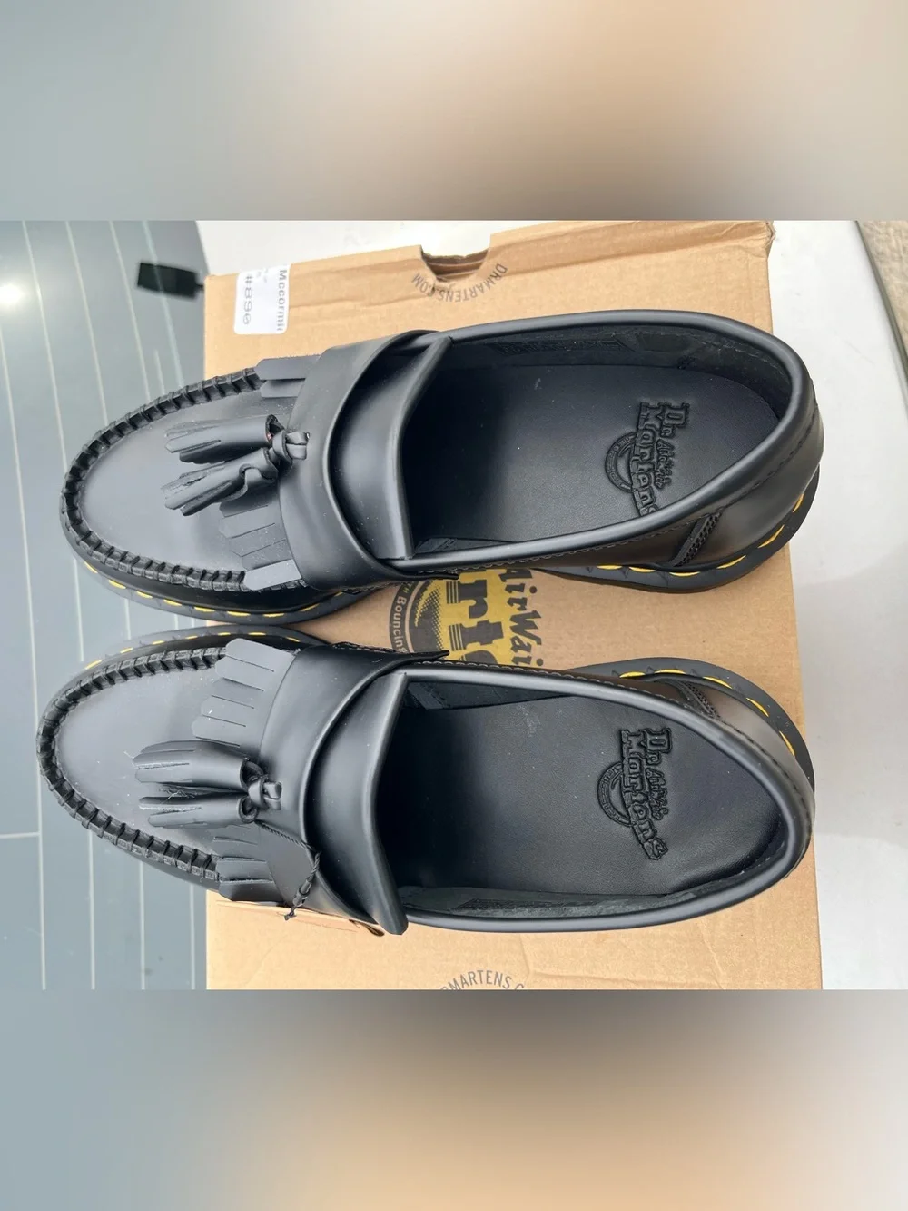 Dr. Martens Black Tassel Kiltie Loafers with Yellow Stitching